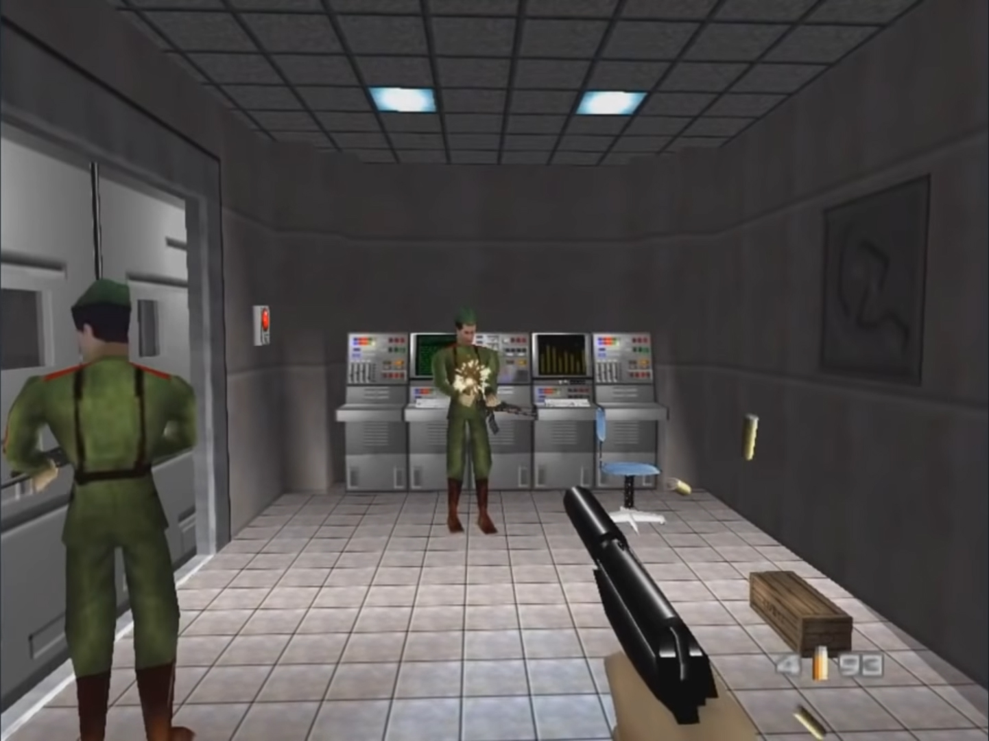 James Bond firing a silenced pistol at guards inside GoldenEye 007's Facility mission